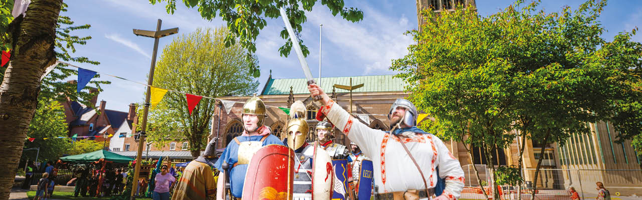 Old town festival happening on Saturday 25 April 2026 from 12noon to 5pm. Image is showing a group of knights in front of Leicester Cathedral.